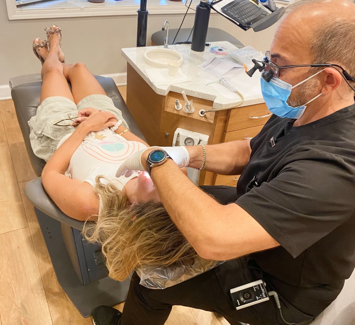 Dr. Peluso works closely with a kids patient